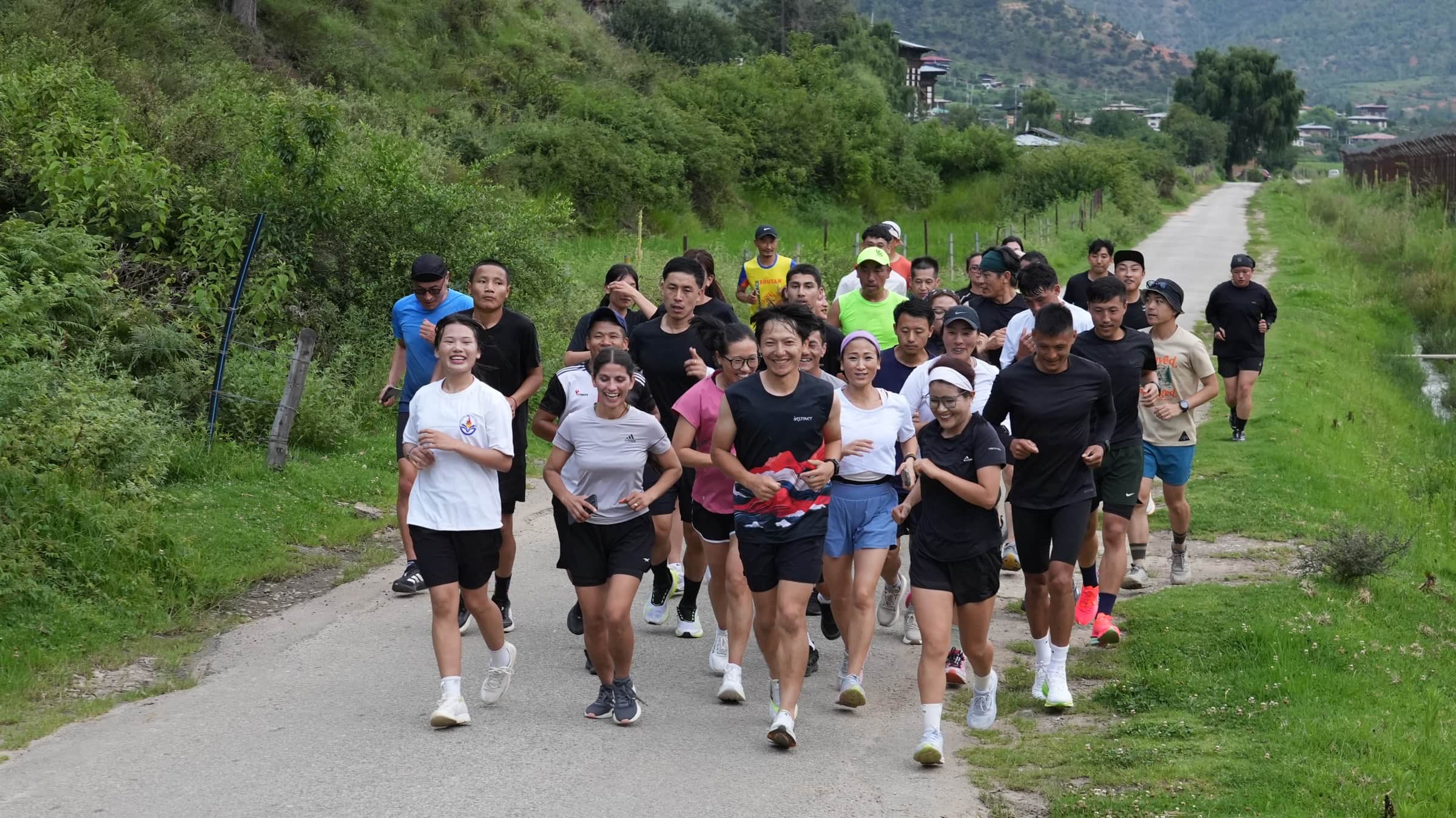 MountaiNation runners on the riverside road in Paro